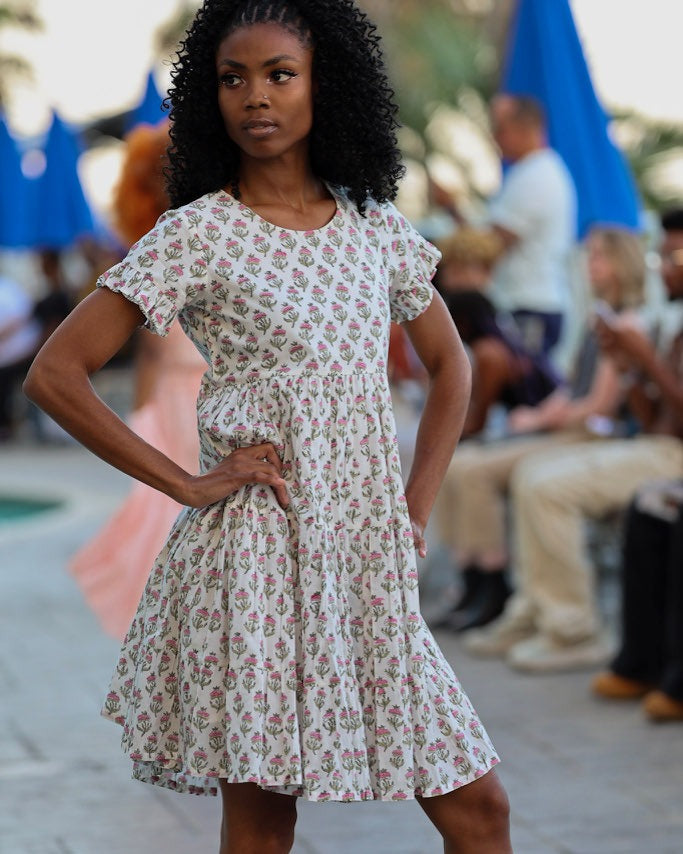 Anna Dress – hand block-printed cream floral tiered cotton dress, runway pose, close front view