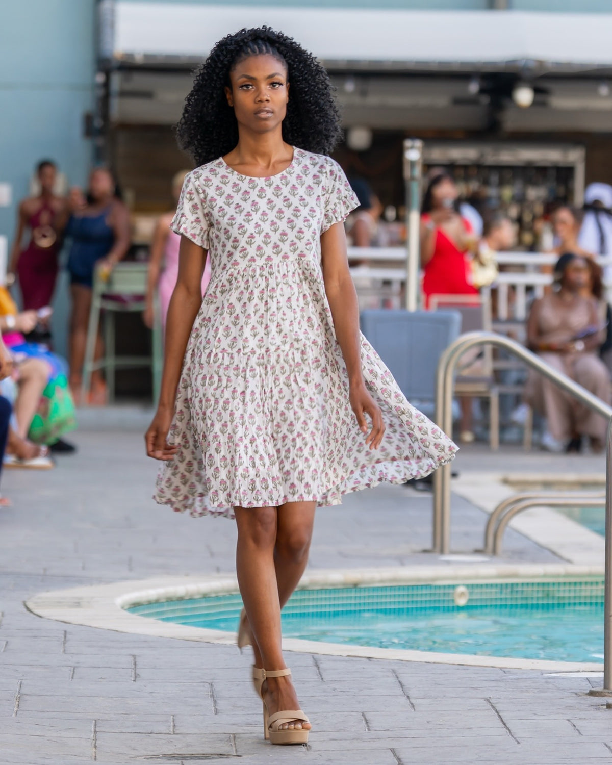 Anna Dress – hand block-printed cream floral tiered cotton dress, runway front view, skirt in motion
