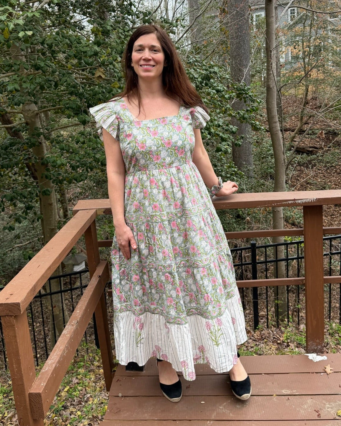 Helena Dress – hand block-printed pink and green floral cotton tiered maxi dress with flutter sleeves and striped hem, full-length front view